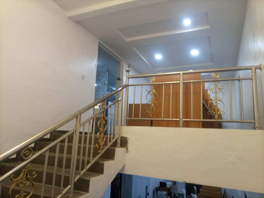 Interior staircase and reception access at Beloved Infotech